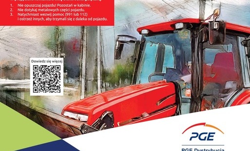 Baner traktor w pobliżu linii energetycznych